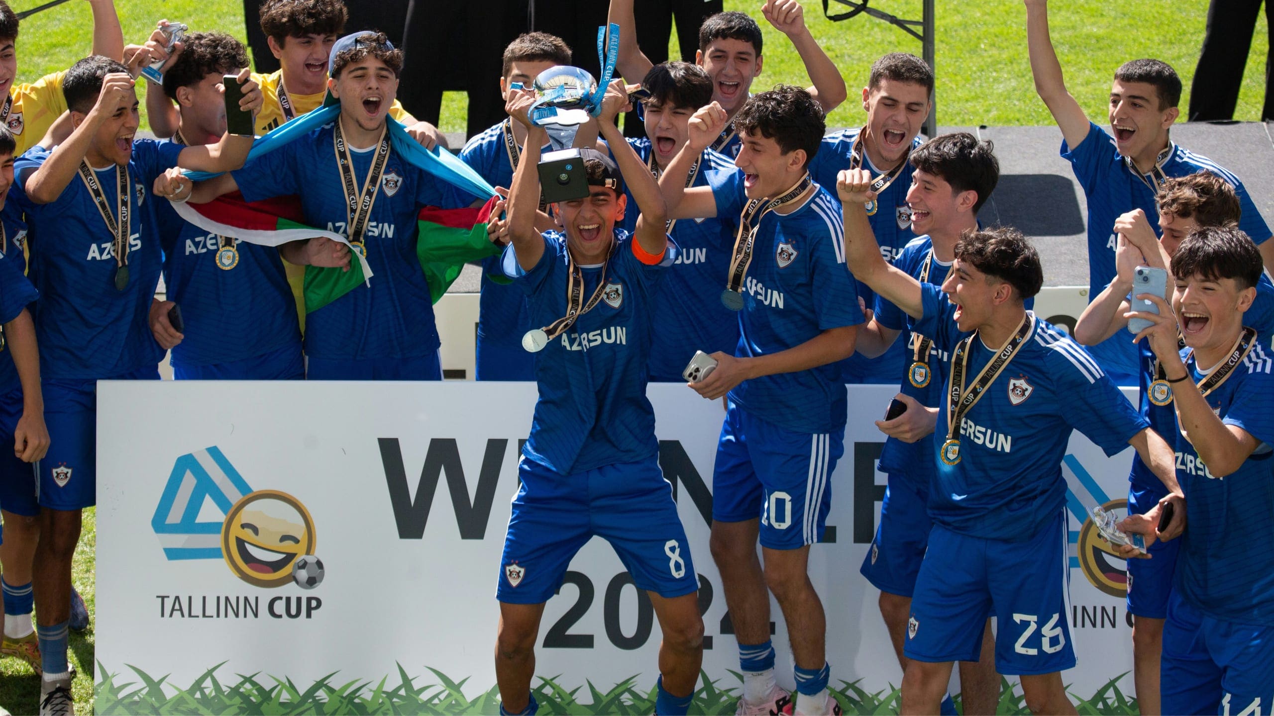 Tallinn Cup winners lifting the trophy on the podium